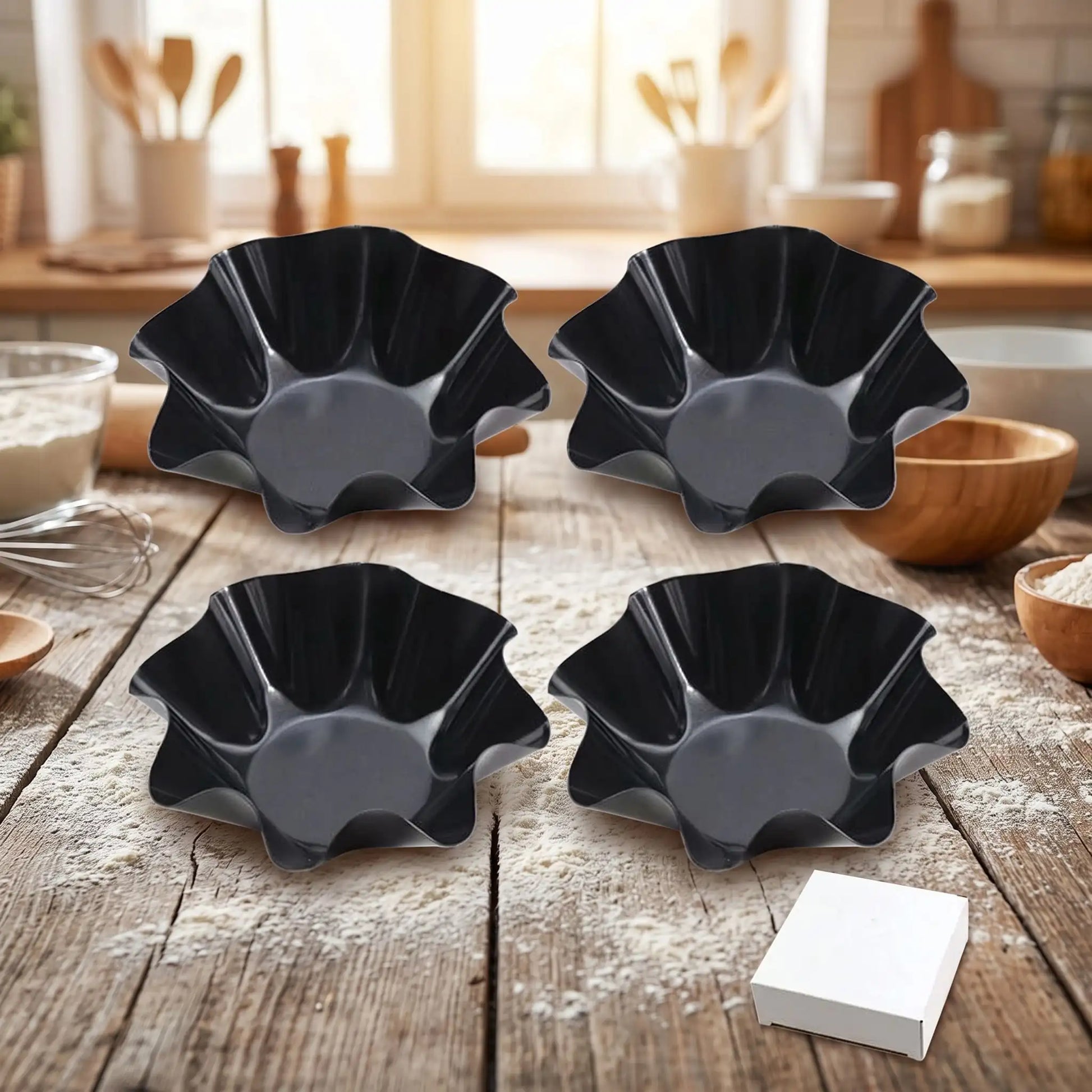 4 moules a tartelette sur table bois dans cuisine