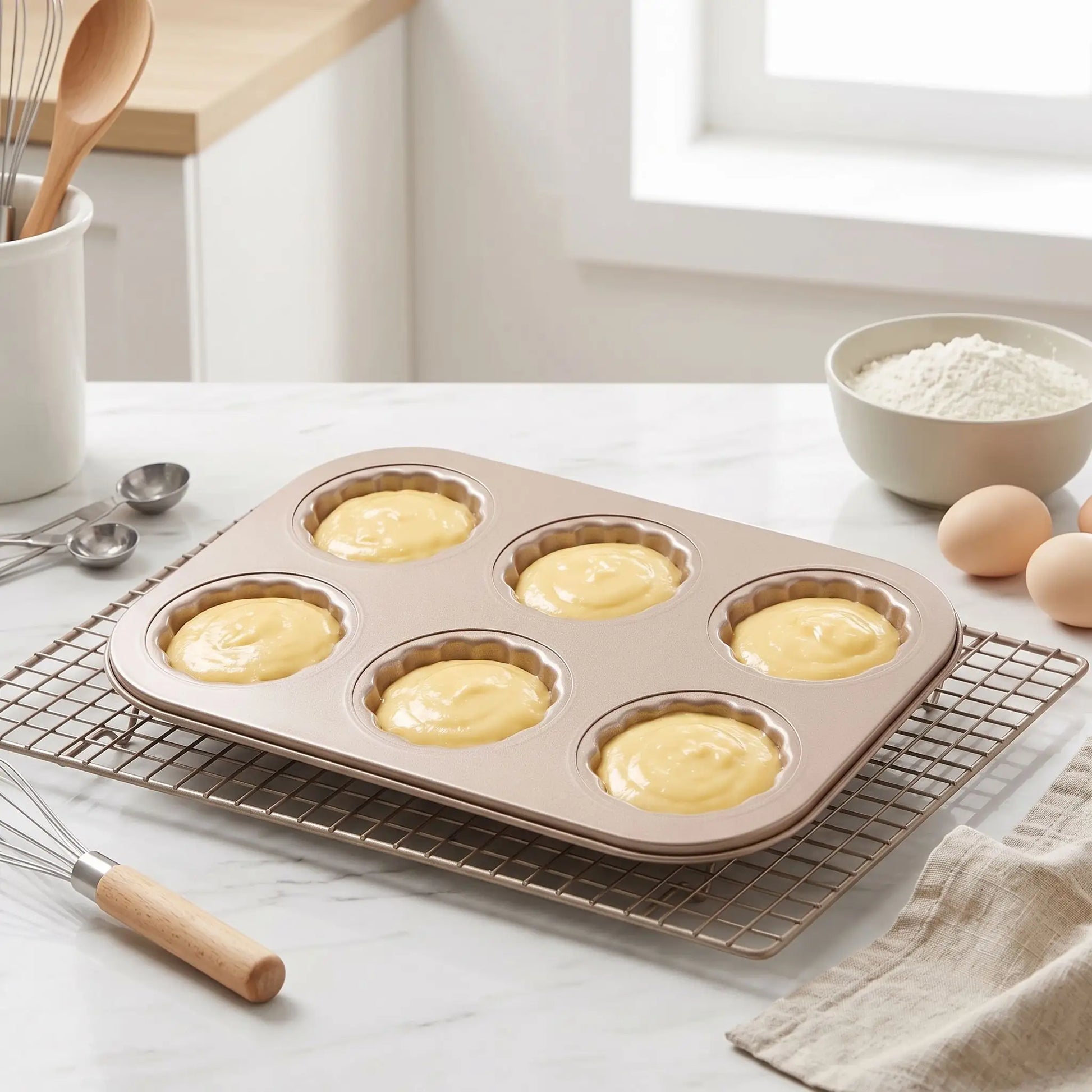moule madeleine sur grille pate dans les empreintes