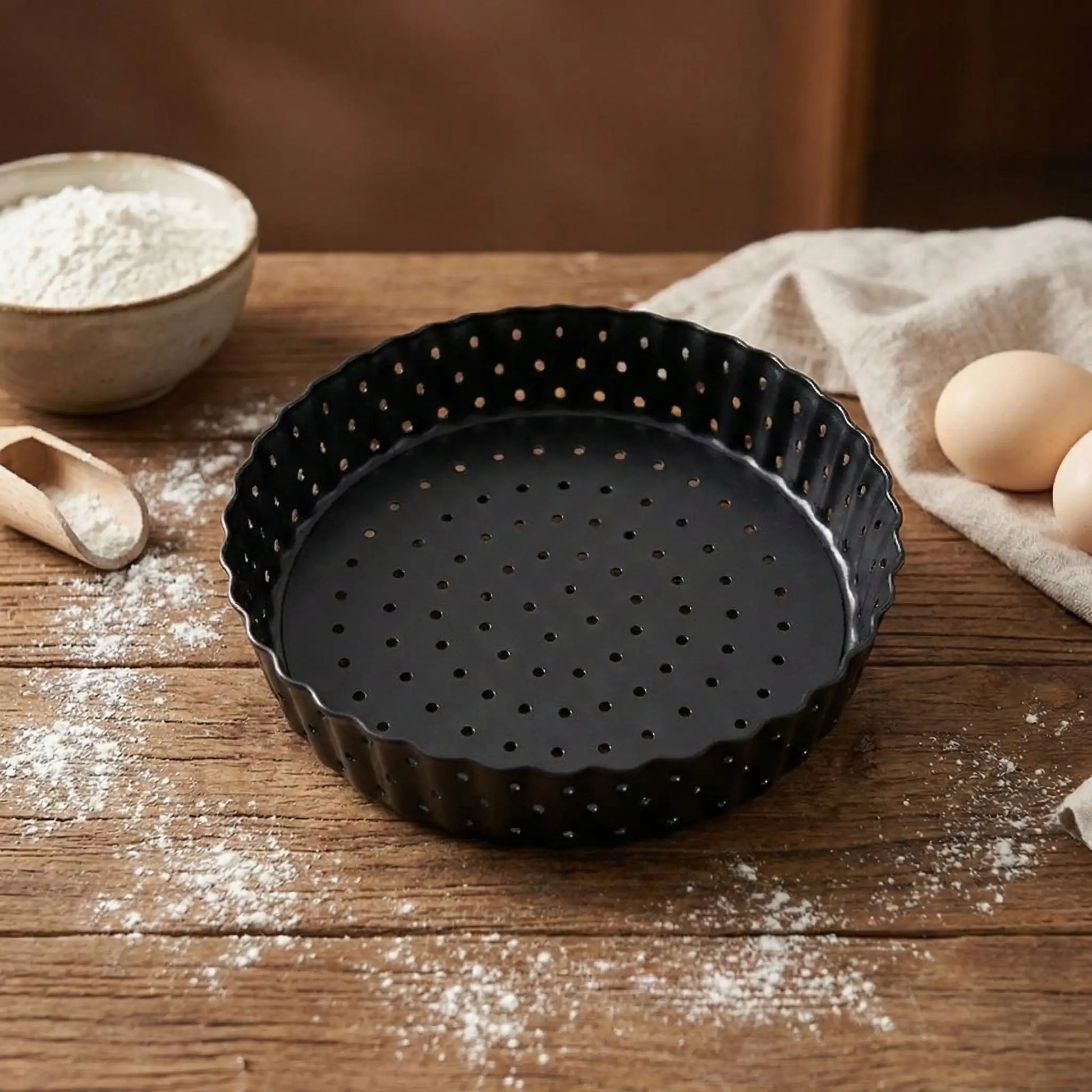moule tarte perfore vide sur table